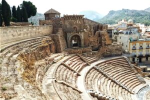 A view of a roman amphit in the middle of a town